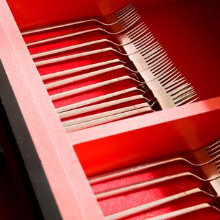 red cutlery drawer with forks