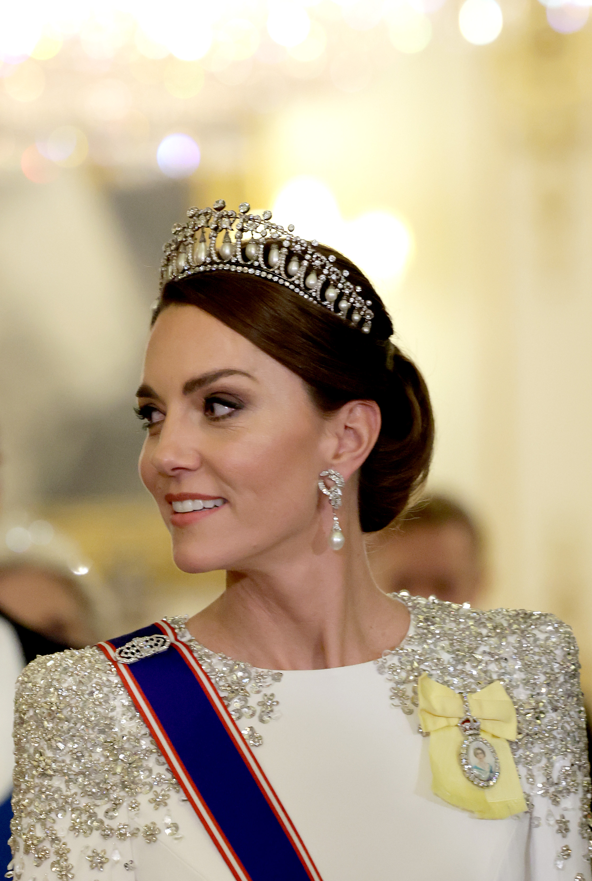 Princess Kate wearing a white and silver gown and a tiara
