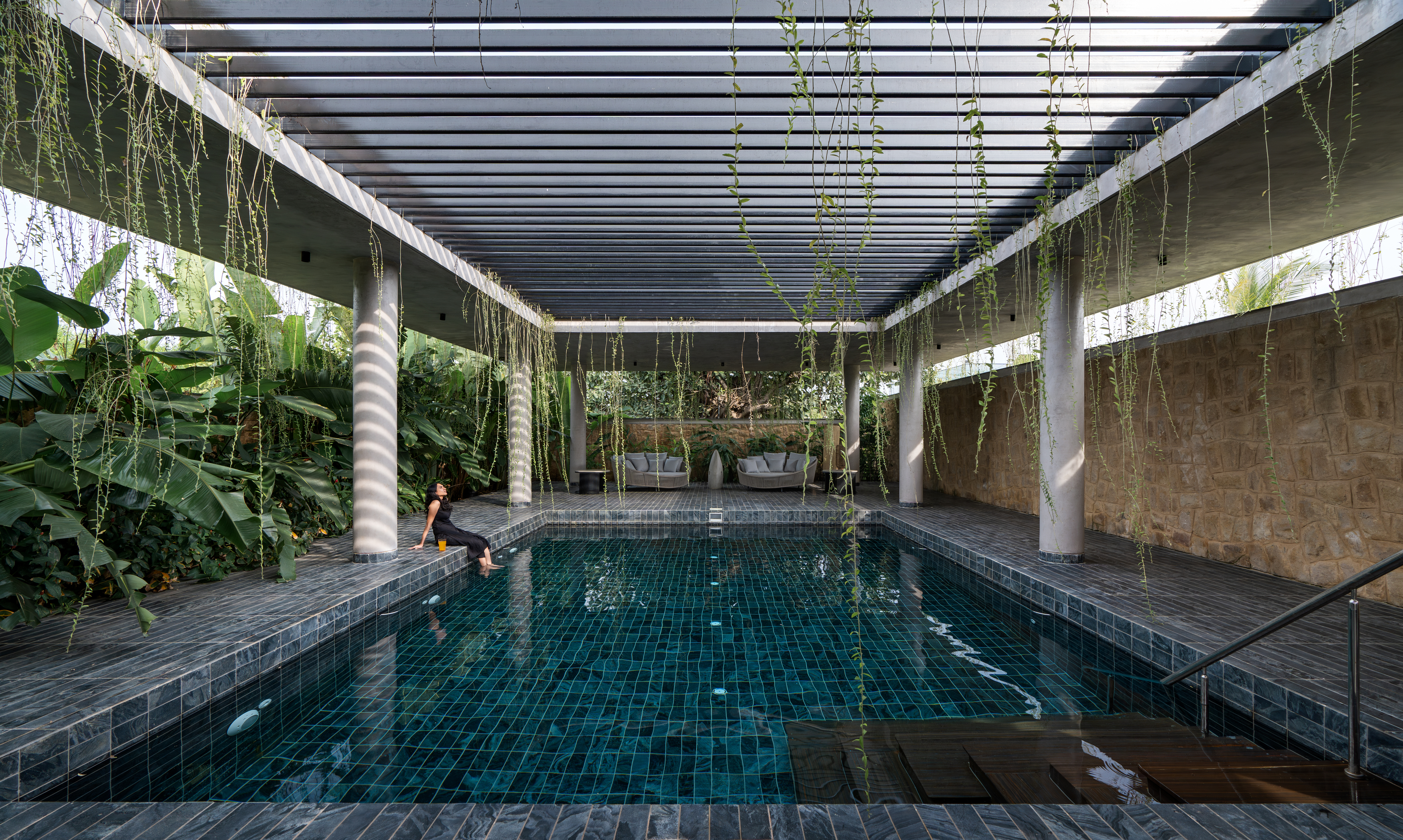 hyderabad home in brutalist style covered in greenery by 23 Degrees Design Shift