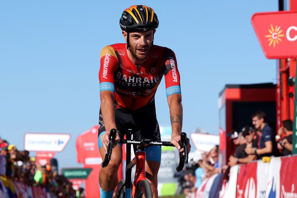 LACRUZDELINARES SPAIN SEPTEMBER 14 EDITORS NOTE Alternate crop Damiano Caruso of Italy and and Team Bahrain Victorious crosses the finish line as second place during the 78th Tour of Spain 2023 Stage 18 a 1789km stage from Pola de Allande to La Cruz de Linares 840m UCIWT on September 14 2023 in La Cruz de Linares Spain Photo by Alexander HassensteinGetty Images