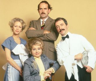 Fawlty Towers cast - Andrew Sachs in Manuel's white jacket.