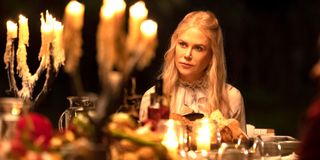 Nicole Kidman (Masha) sits in candlelight at Tranquillum House in Nine Perfect Strangers