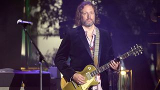 Rich Robinson performs onstage