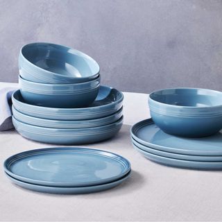 Blue Stoneware Le Creuset plates and bowls