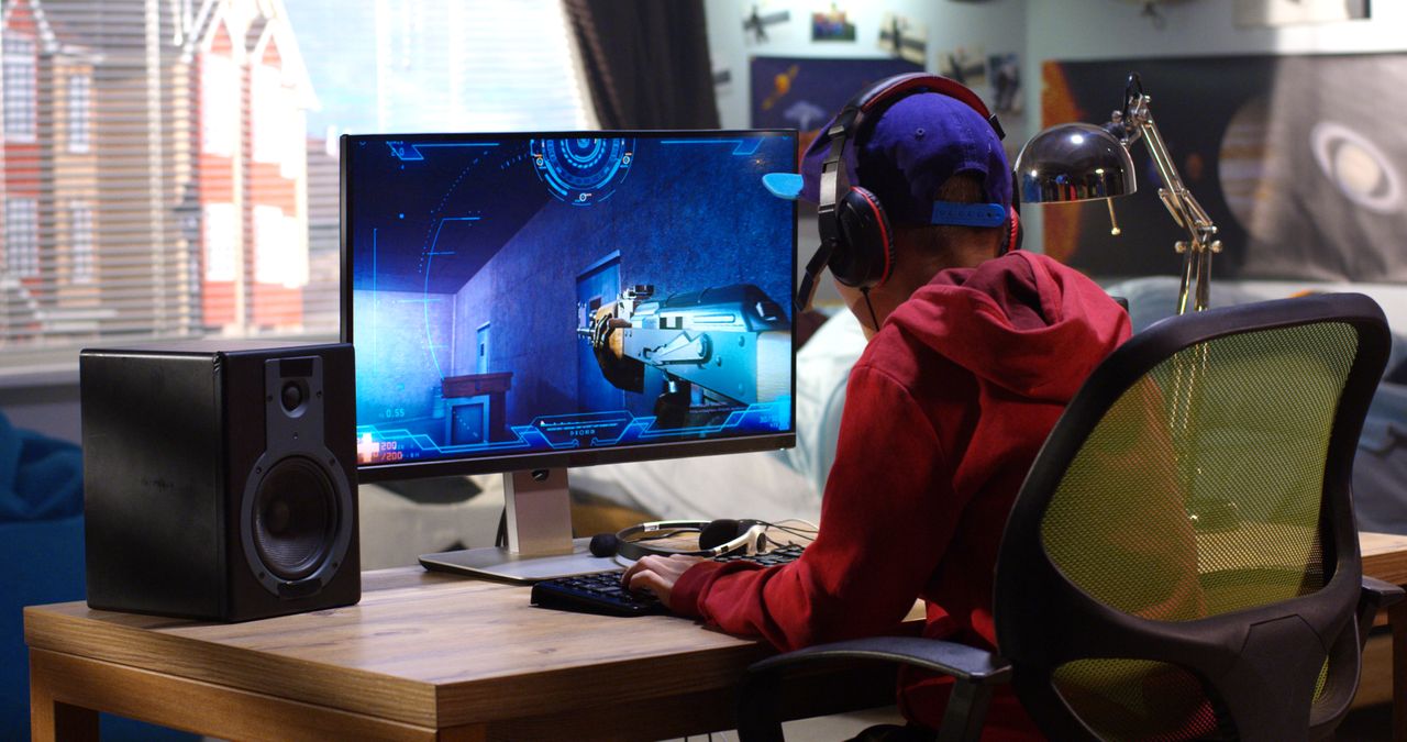 A boy playing video games.