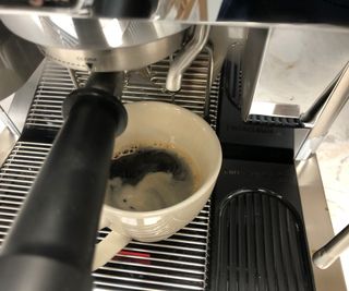 De'Longhi La Specialista Maestro Espresso Machine making an Americano