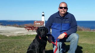 K9 Sheldon the Labrador and John