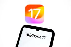 The iPhone 17 logo appears on a smartphone screen and as the background on a laptop computer screen in this photo illustration in Athens, Greece, on September 19, 2025. 