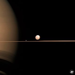 Elisabetta Bonora captured this image of Saturn, its rings and two moons from Cassini data.