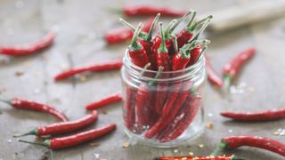 glass jar of chilli peppers