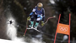 An FPV drone following a downhill skier at the Milan Winter Olympics 2026
