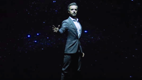 A hologram comes to life showering the audience with stars Screen Innovations. 