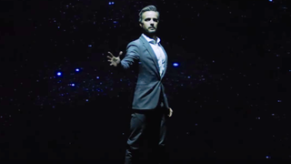 A hologram comes to life showering the audience with stars Screen Innovations. 