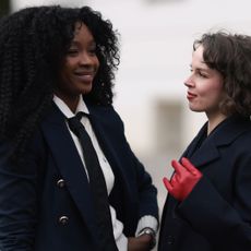 two women photographed at copenhagen fashion week, both wearing tailored jackets - best everyday foundations