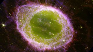 a pink and green cloud of gas in space