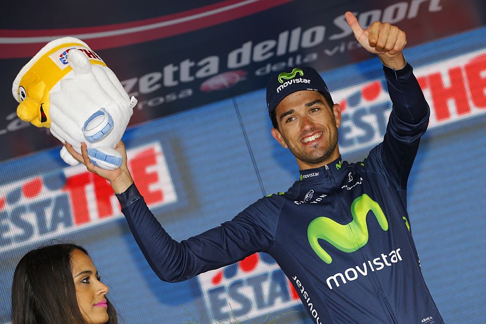 Movistar's Be&ntilde;at Intxausti gives a thumbs up on the stage 8 podium
