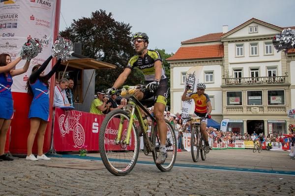 Alban Lakata crosses the line just in front of race winner Christoph Sauser