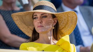 Kate Middleton wearing a straw hat at Wimbledon