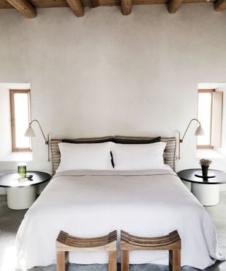 Minimalist white bedroom in greek villa