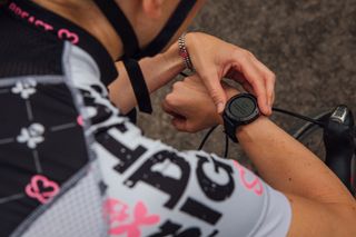 Image shows a rider looking at heart rate data.