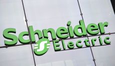 Green Schneider Electric logo outside an office building
