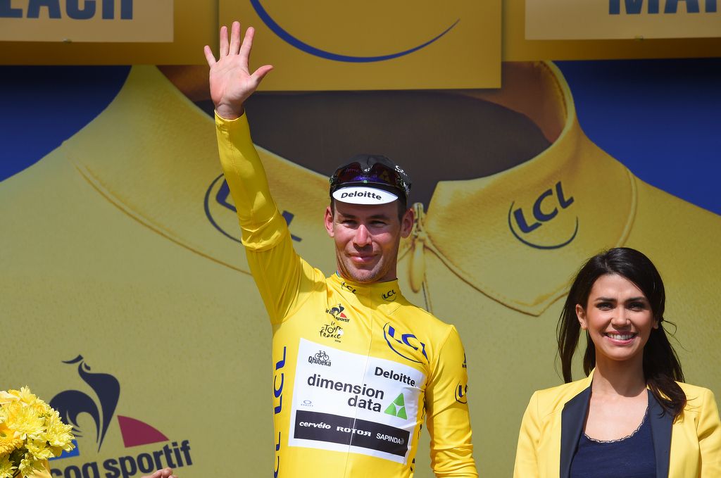 Mark Cavendish celebrates the first yellow jersey of his career and first for Dimension Data