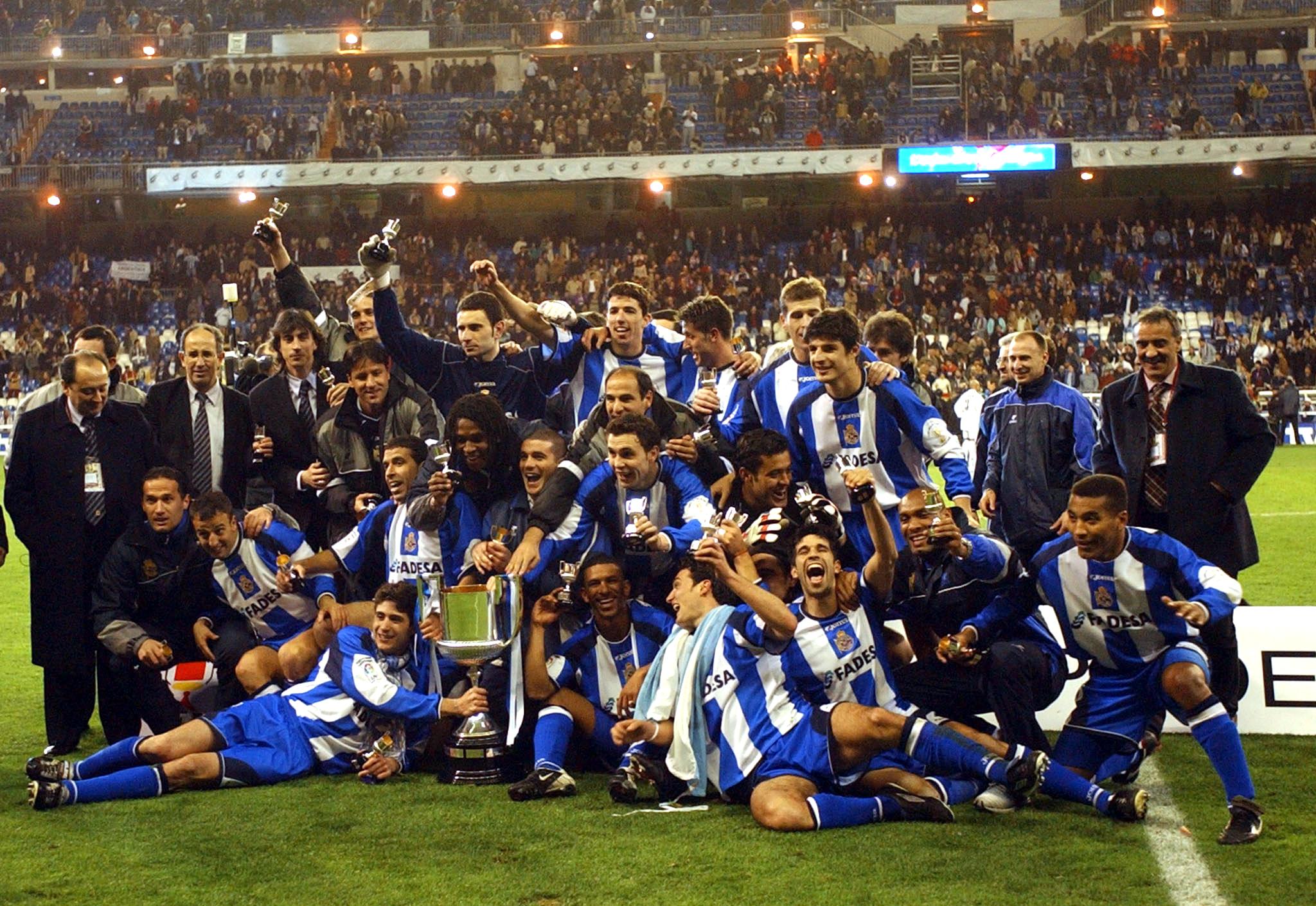 Deportivo La Coruña players and staff celebrate the club's Copa del Rey final win over Real Madrid in March 2002.