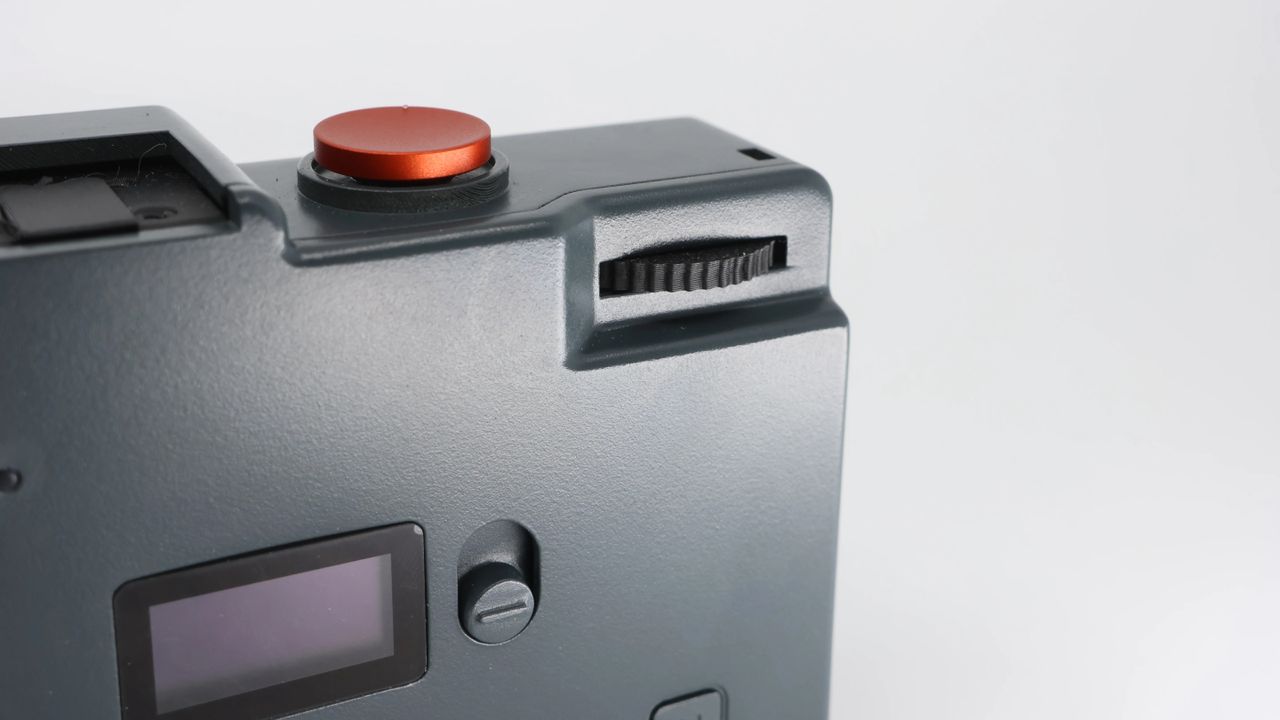 The Rewindpix retro compact camera on a white background