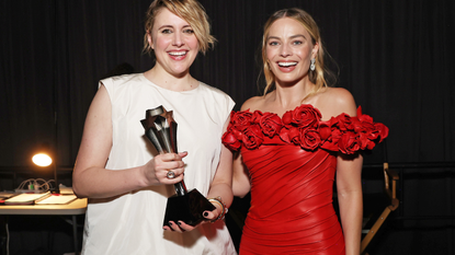 Greta Gerwig and Margot Robbie, winners of the Best Comedy Award for 'Barbie,' pose backstage during the 29th Annual Critics Choice Awards at Barker Hangar on January 14, 2024 in Santa Monica, California