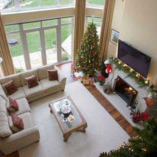 living room with white walls and sofa set with cushion