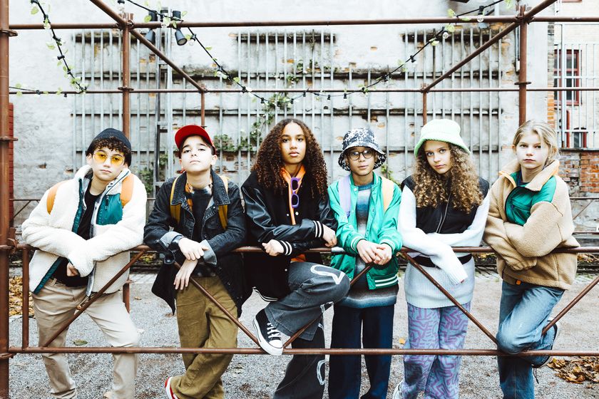 Gen alpha teenagers stood in a row