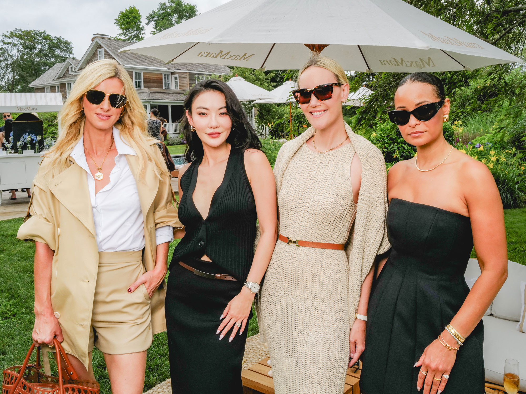 four women pose at a Max Mara event
