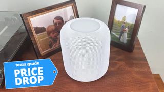 Apple HomePod 2 on top of table with price drop badge nearby.
