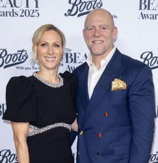 Zara Tindall wearing a black dress and Mike Tindall in a blue blazer at the Beauty Awards
