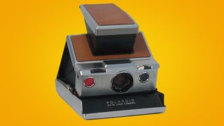 Polaroid SX70 on an orange background