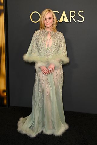 Elle Fanning on red carpets for a complete unknown wearing 60s inspired outfits