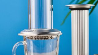 a glass AeroPress premium with aluminum flourishes