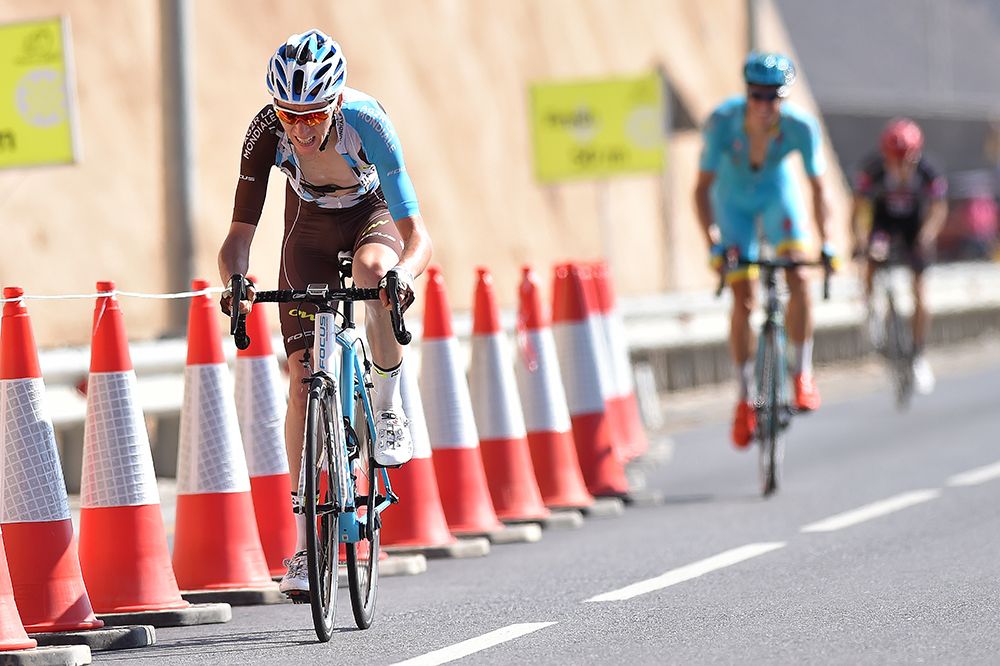 Romain Bardet drives for the line, followed by Jakub Fuglsang