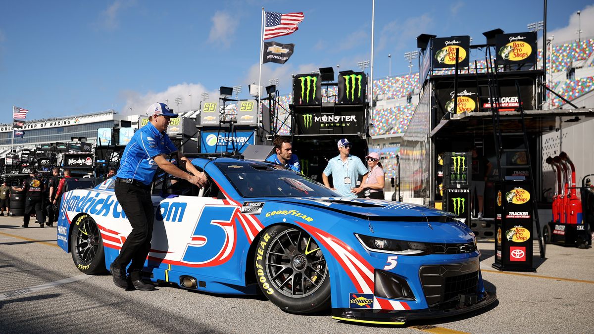 DAYTONA BEACH, FLORIDA - FEBRUARY 12: Crew members push the #5 HendrickCars.com Chevrolet driven by Kyle Larson in the garage area during practice for the NASCAR Cup Series Daytona 500 at Daytona International Speedway on February 12, 2025 in Daytona Beach, Florida.