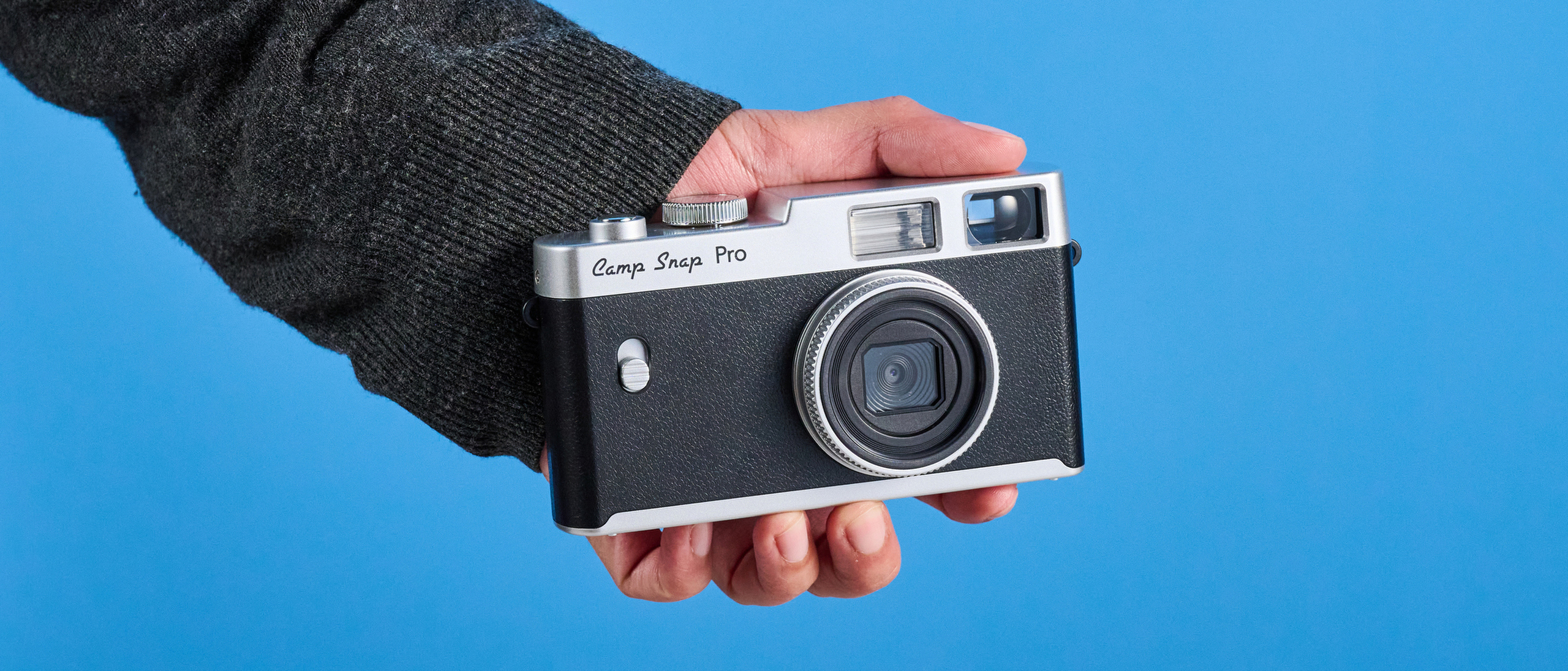 Camp Snap CS-Pro in black and silver photographed on a blue background