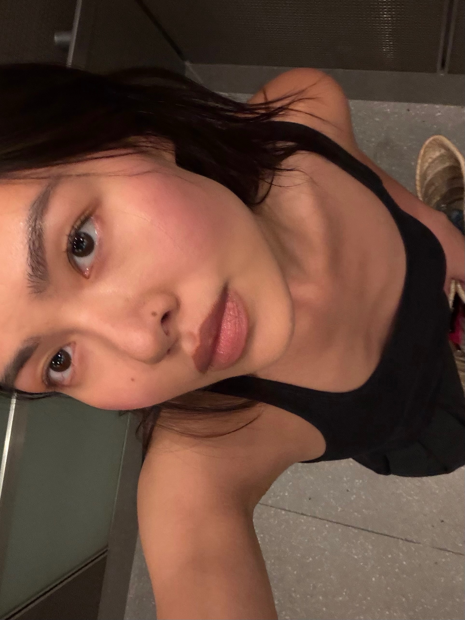 A woman with blushed cheeks.