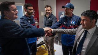 Ted Lasso cast bumping fists in locker room