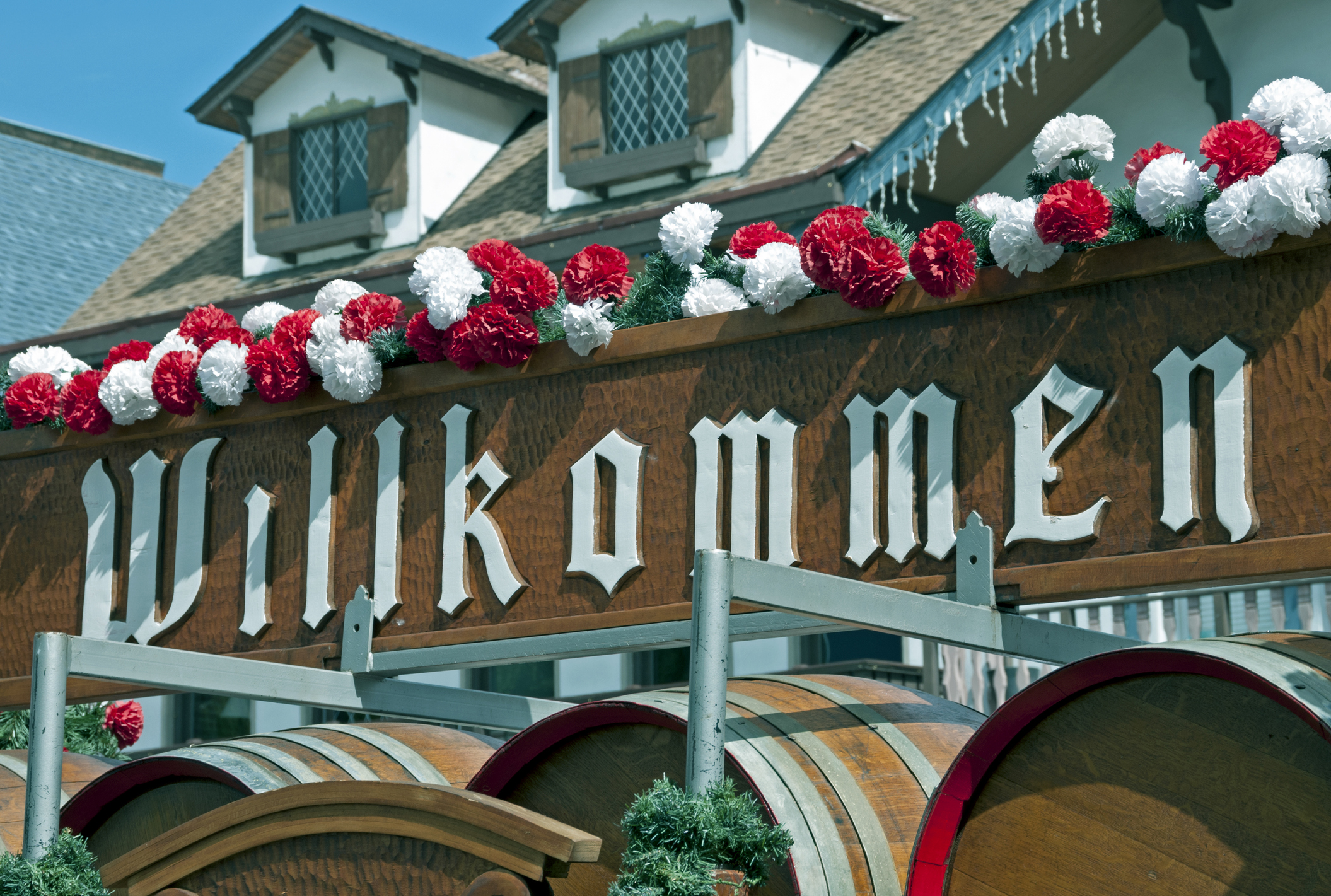 Wagon stacked with beer barrels under a sign welcoming guests to Beer Fest