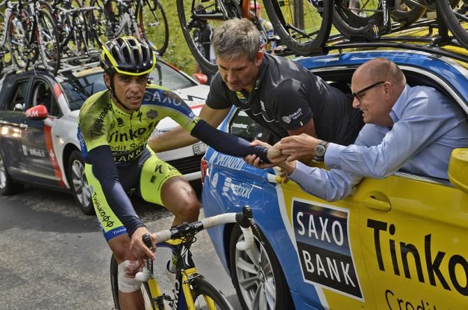 Alberto Contador discussing the extent of his injuries with Bjarne Riis after crashing on the tenth stage of the Tour de France before retiring from the race