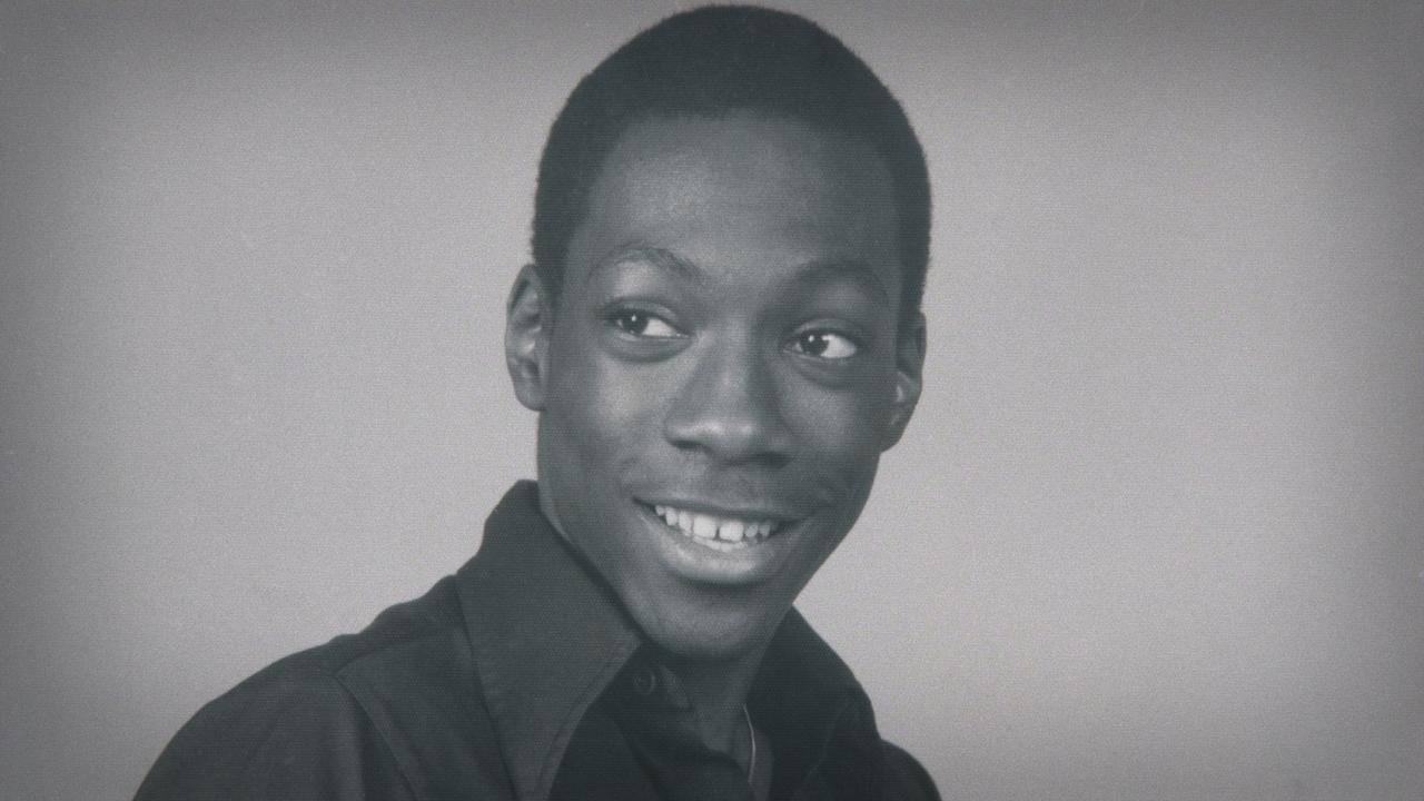 Eddie Murphy smiles in a throwback photo.