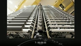 A view of the 60 Starlink satellites stacked for launch on the Starlink-3 mission.