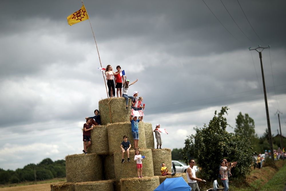 Straw bales provide a viewing platform for these young fans
