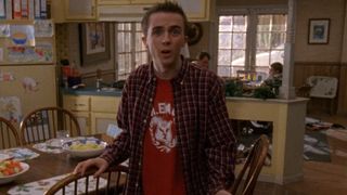 Malcolm talking to the camera in the kitchen on Malcolm in the Middle.