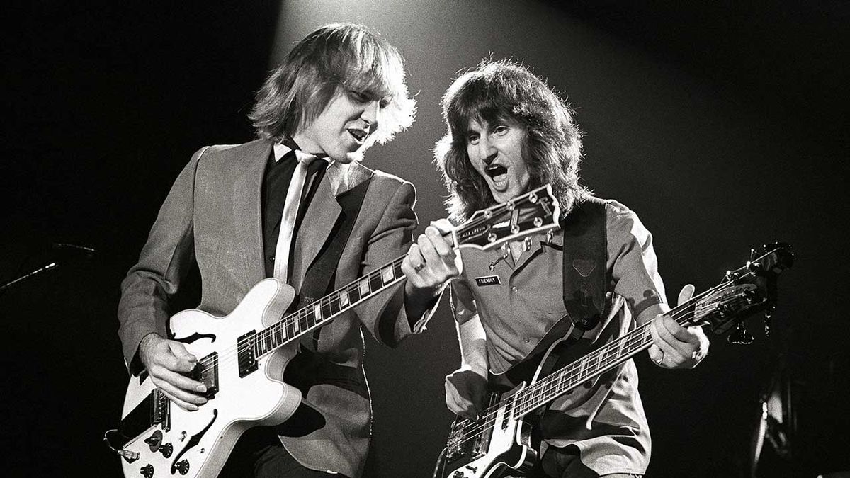 Alex Lifeson and Geddy Lee performing live onstage on Exit...Stage Left tour