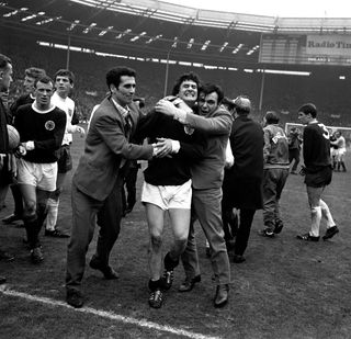 Fans embrace Jim Baxter after Wembley success